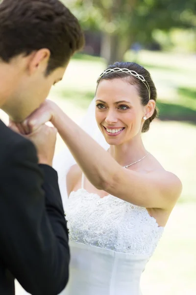 Groom kissing on hand of beautiful bride — Stock Photo, Image