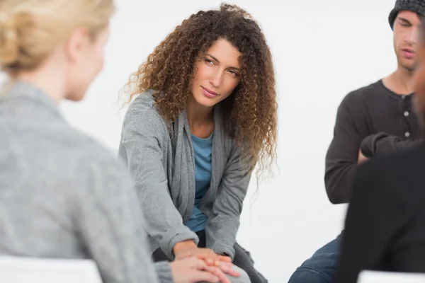 Woman comforting another in rehab group at therapy — Stock Photo, Image
