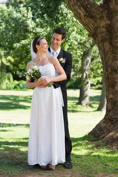 Newly wed couple in park Stock Photo