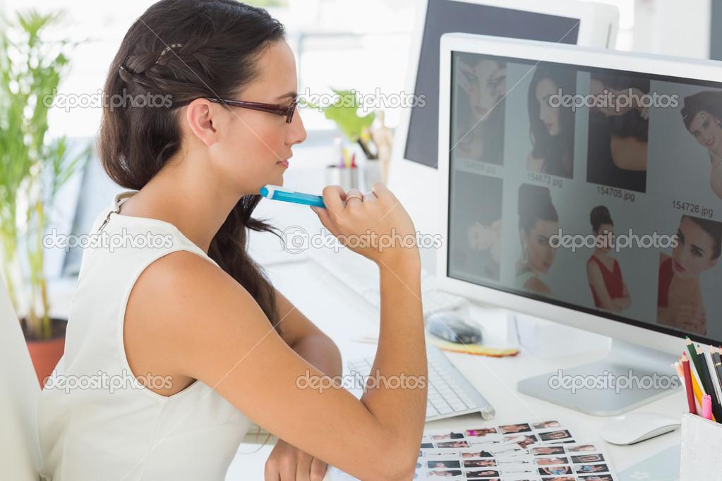 Focused young editor working — Stock Photo © Wavebreakmedia 42937643