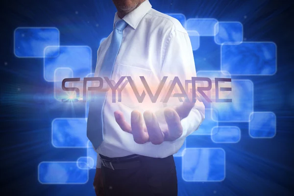 Uomo d'affari che presenta la parola - spyware — Foto Stock