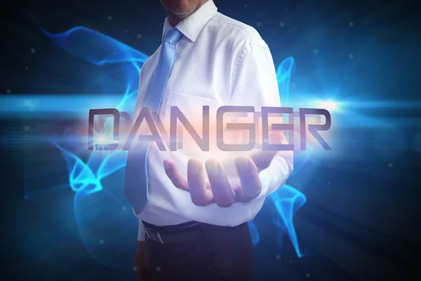 Businessman presenting the word - danger — Stock Photo, Image