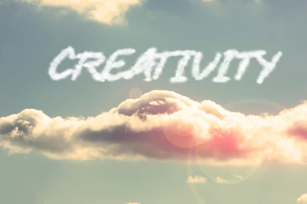 Creativity - against bright blue sky with cloud — Stock Photo, Image