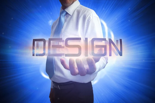 Homme d'affaires présentant le mot - design — Photo