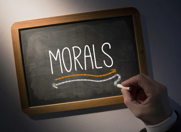 Hand writing Morals on chalkboard — Stock Photo, Image