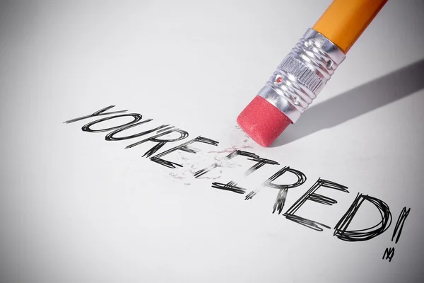 Pencil erasing the word youre fired — Stock Photo, Image