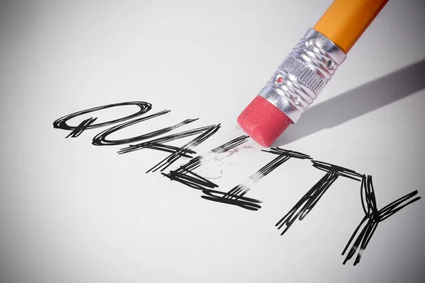 Pencil erasing the word Quality — Stock Photo, Image