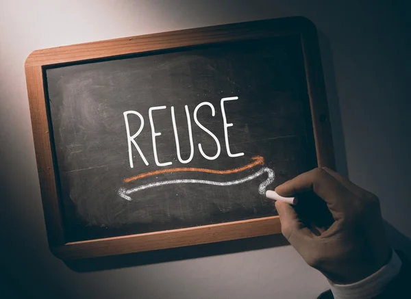 Hand writing Reuse on chalkboard — Stock Photo, Image