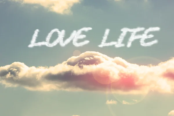 Love life - against bright blue sky with cloud — Stock Photo, Image