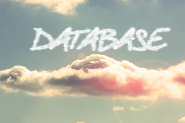 Base di dati - contro cielo azzurro vivo con nube — Foto Stock