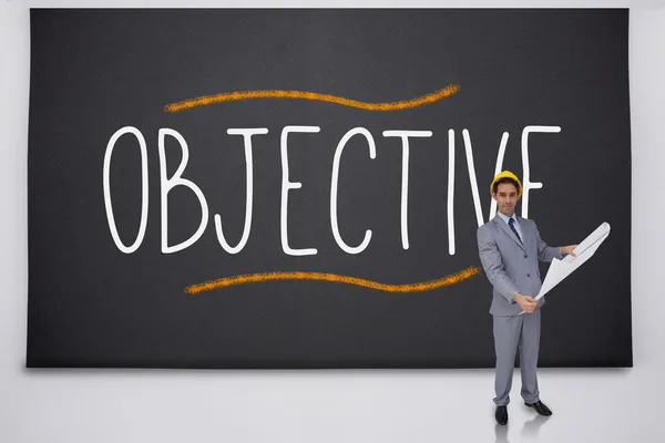 Architect standing against the word objective — Stock Photo, Image