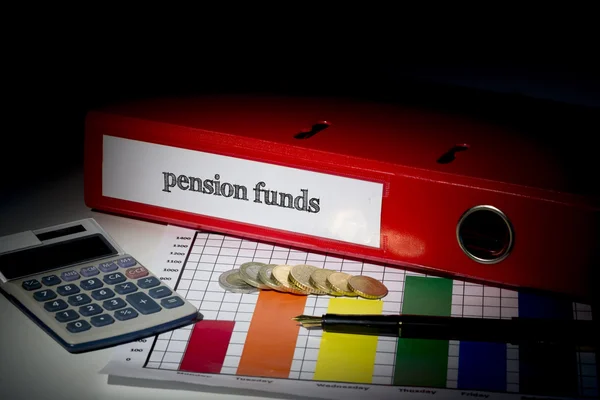 Pension funds on red business binder — Stock Photo, Image