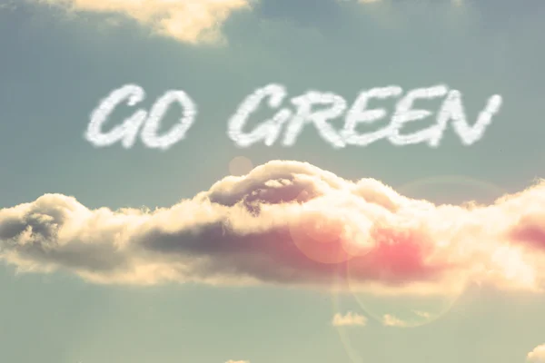 Go greeen - against bright blue sky with cloud — Stock Photo, Image