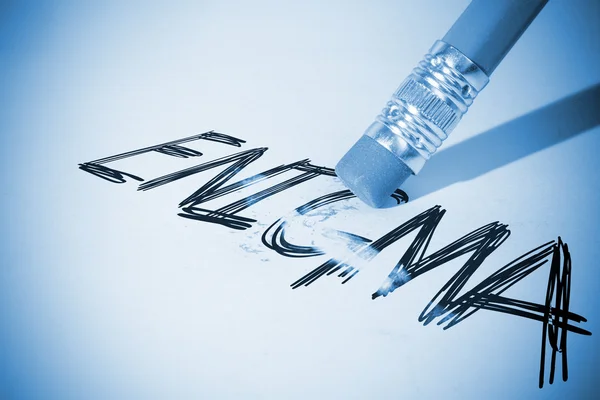 Pencil erasing the word Enigma — Stock Photo, Image