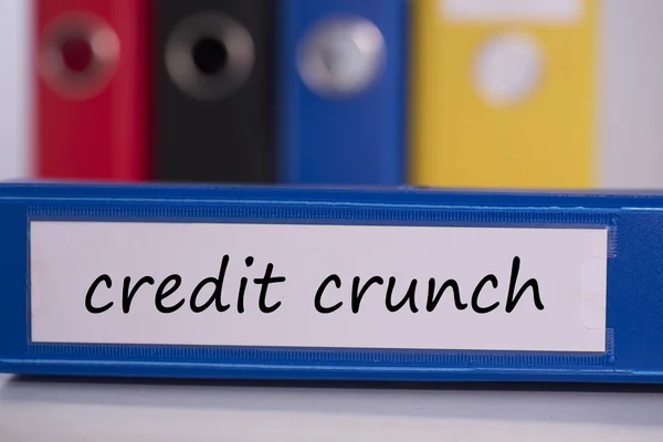 Credit crunch on blue business binder — Stock Photo, Image