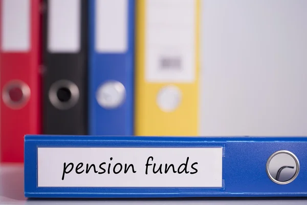 Pension funds on blue business binder — Stock Photo, Image