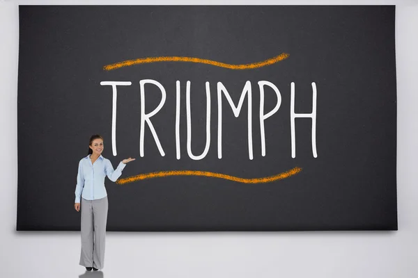 Empresária apresentando a palavra triunfo — Fotografia de Stock