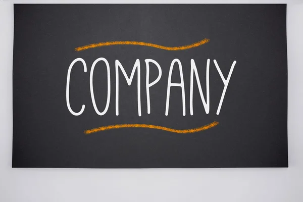 Company written on big blackboard — Stock Photo, Image