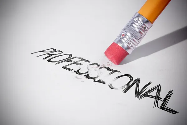 Pencil erasing the word Professional — Stock Photo, Image