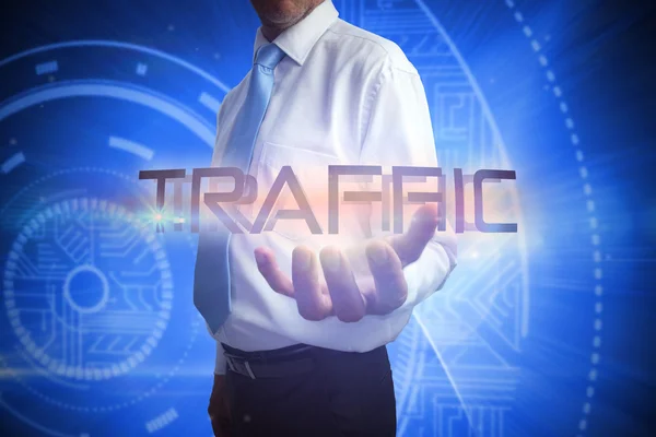 Businessman presenting the word traffic — Stock Photo, Image