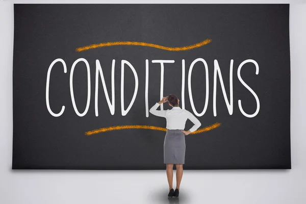 Businesswoman considering the word conditions — Stock Photo, Image