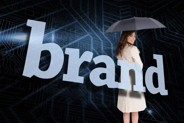 Businesswoman behind the word brand — Stock Photo, Image