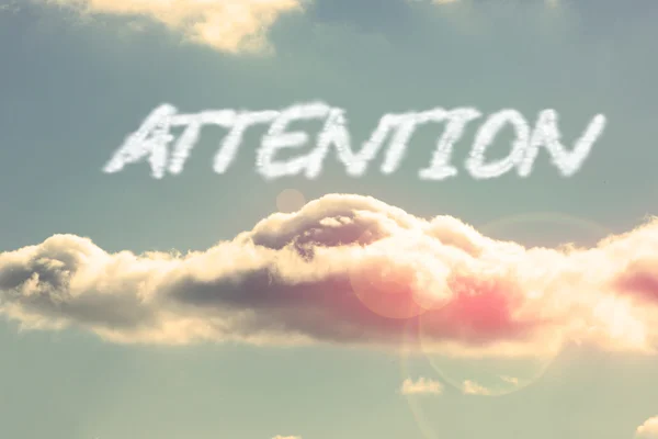 Attention - against bright blue sky with cloud — Stock Photo, Image