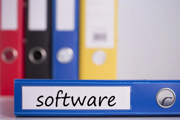 Software on blue business binder — Stock Photo, Image