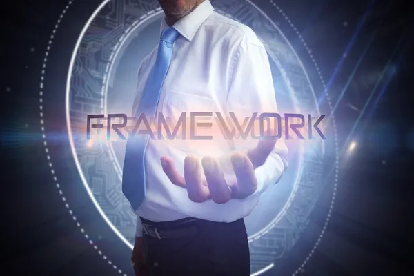 Businessman presenting the word - framework — Stock Photo, Image