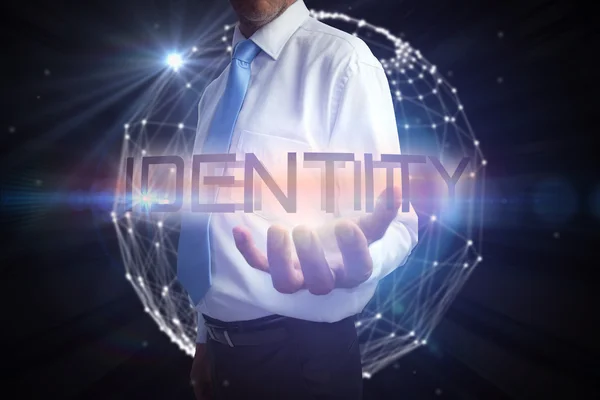 Businessman presenting the word - identity — Stock Photo, Image