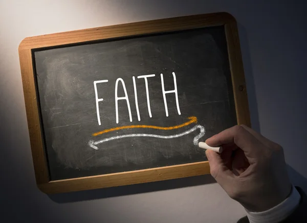 Hand writing Faith on chalkboard — Stock Photo, Image