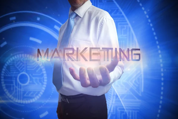 Affärsman presentera marknadsföring ordet — Stockfoto