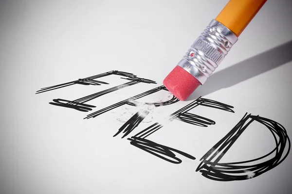 Pencil erasing the word Fired — Stock Photo, Image