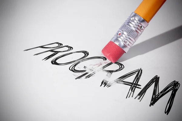 Pencil erasing the word Program — Stock Photo, Image