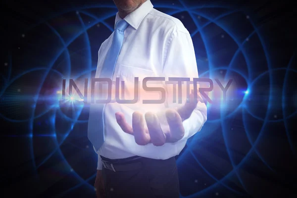 Businessman presenting the word industry — Stock Photo, Image