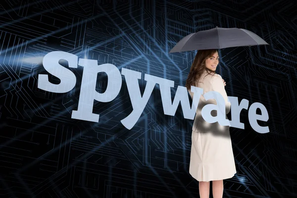 Businesswoman behind the word spyware — Stock Photo, Image