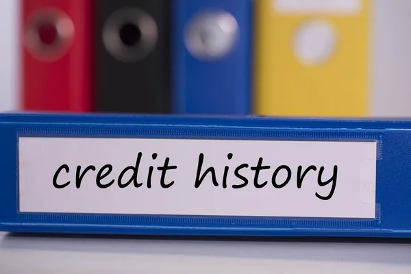 Kredietgeschiedenis op blauwe zakelijke binder — Stockfoto