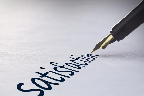 Fountain pen writing - Satisfaction — Stock Photo, Image