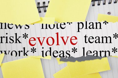 Evolve against sticky notes strewn over notepad clipart