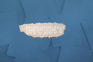 Invent against digitally generated blue paper strewn clipart