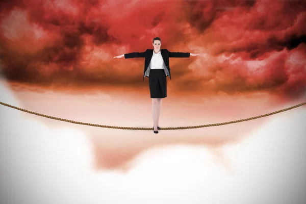 Businesswoman performing a balancing act — Stock Photo, Image