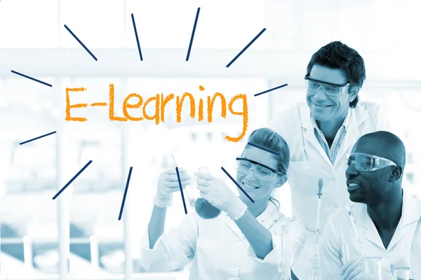 E-learning against scientists working in laboratory — Stock Photo, Image