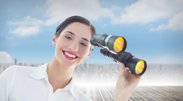 Business woman with binoculars — Stock Photo, Image