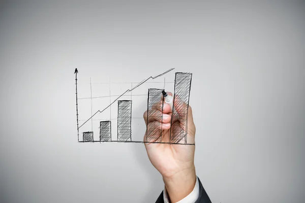 Businessman drawing graph — Stock Photo, Image