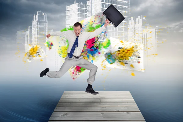 Jumping businessman with his suitcase — Stock Photo, Image