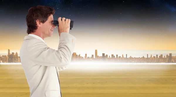 Businessman using binoculars — Stock Photo, Image
