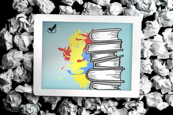 Composite image of pile of books on paint splashes — Stock Photo, Image