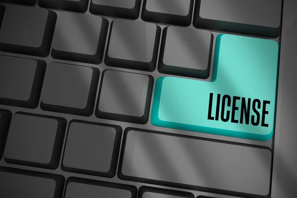 License on black keyboard — Stock Photo, Image