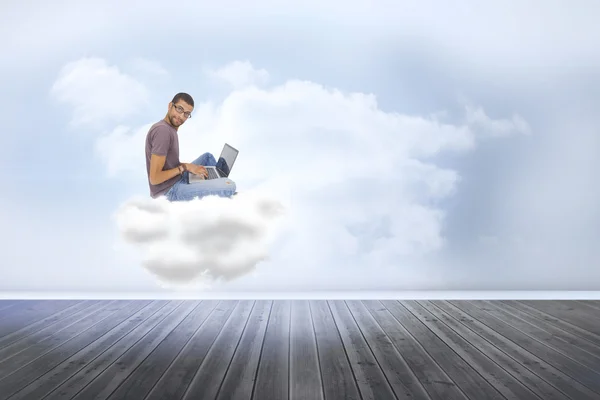 Man sitting on cloud  using laptop — Stock Photo, Image