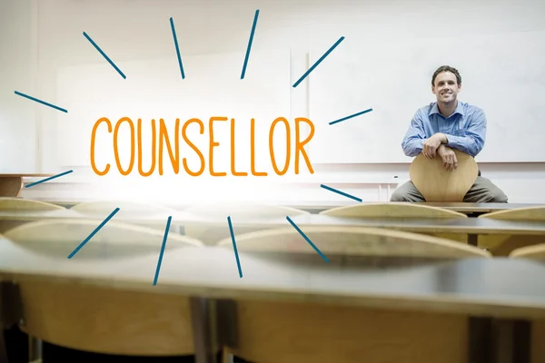 Counsellor against lecturer sitting in lecture hall — Stock Photo, Image